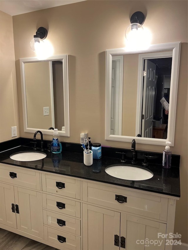 bathroom featuring vanity and hardwood / wood-style flooring