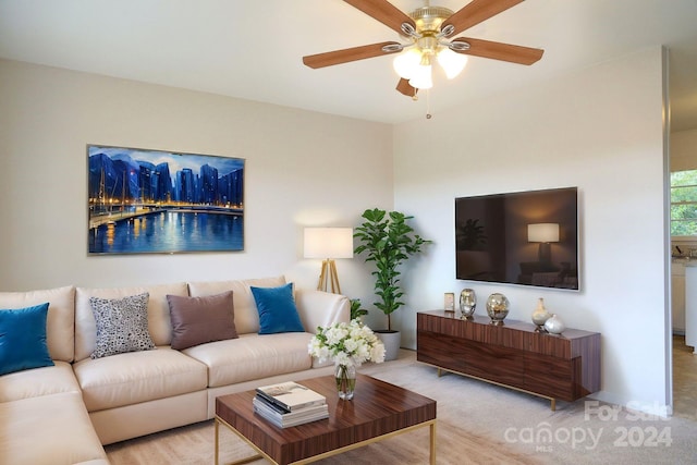 living room featuring light colored carpet and ceiling fan