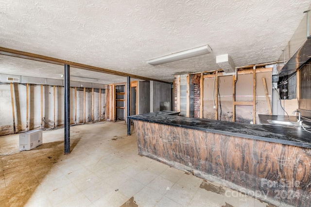 interior space with a textured ceiling