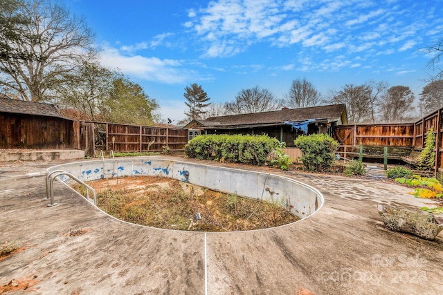 view of swimming pool featuring a deck