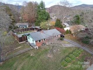 birds eye view of property featuring a mountain view