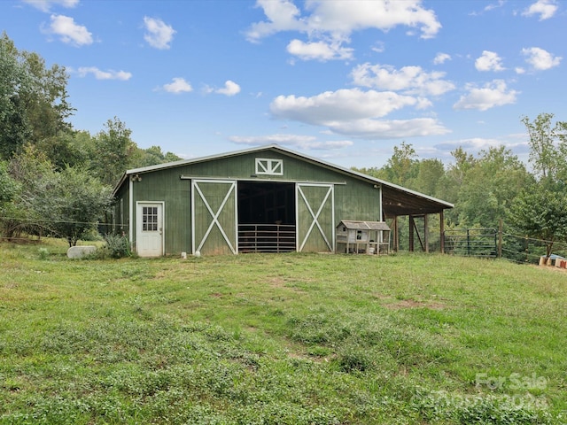 view of outdoor structure featuring a yard