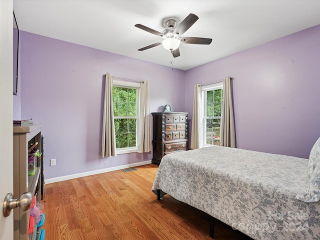 bedroom featuring hardwood / wood-style floors and ceiling fan