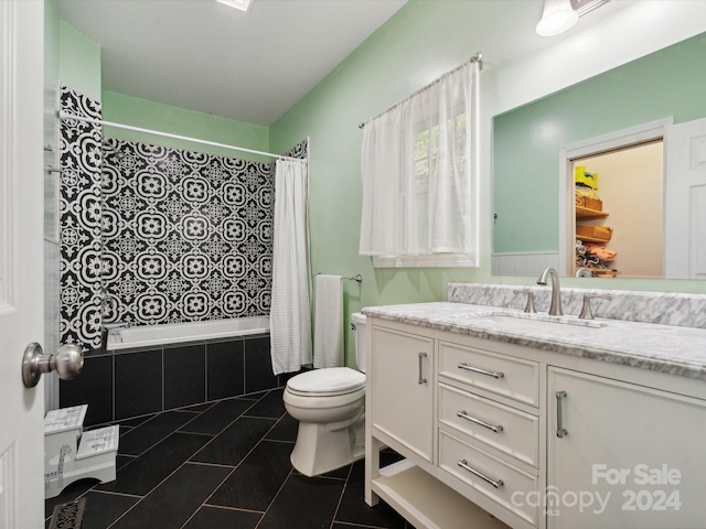 full bathroom featuring toilet, shower / bath combo, vanity, and tile patterned floors