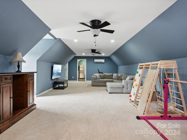 recreation room with lofted ceiling, a wall unit AC, light carpet, and ceiling fan