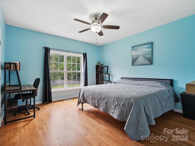 bedroom featuring light wood-type flooring and ceiling fan