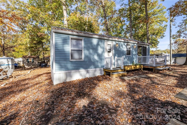 view of front of property with a wooden deck