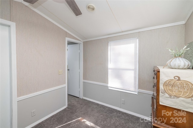 bedroom with ceiling fan, crown molding, vaulted ceiling, and dark carpet