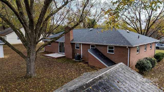 exterior space with central AC and a patio area