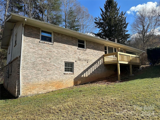 back of house with a lawn