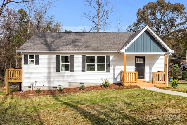 single story home featuring a front lawn