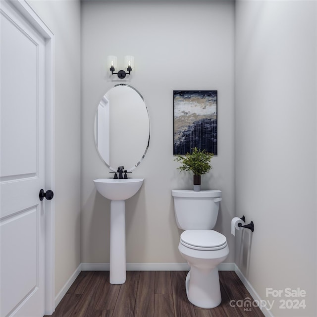 bathroom with wood-type flooring and toilet