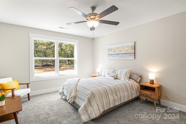 bedroom with ceiling fan and carpet