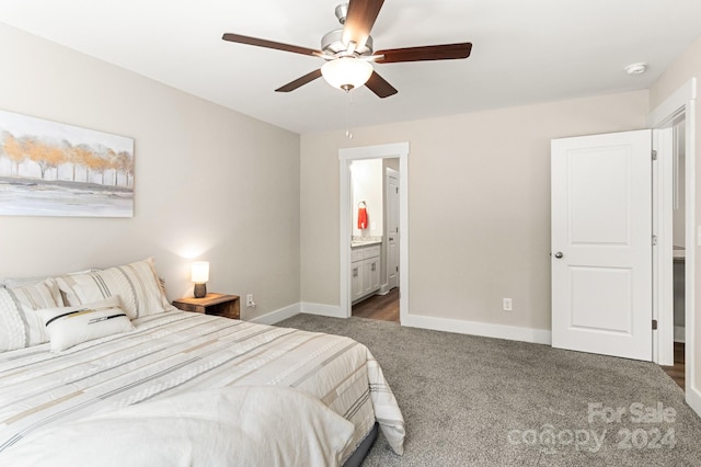 bedroom featuring connected bathroom, ceiling fan, and dark carpet