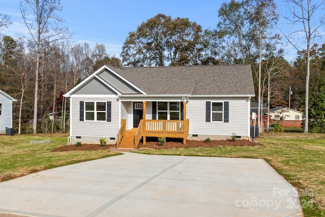 109 Orchard St, Forest City, NC 28043 - view of front of house featuring crawl space, covered porch, a front lawn, roof with shingles, and central AC unit