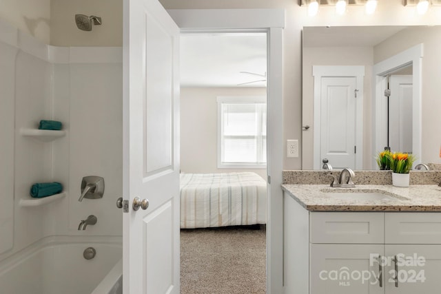 bathroom featuring shower / tub combination, vanity, and ceiling fan