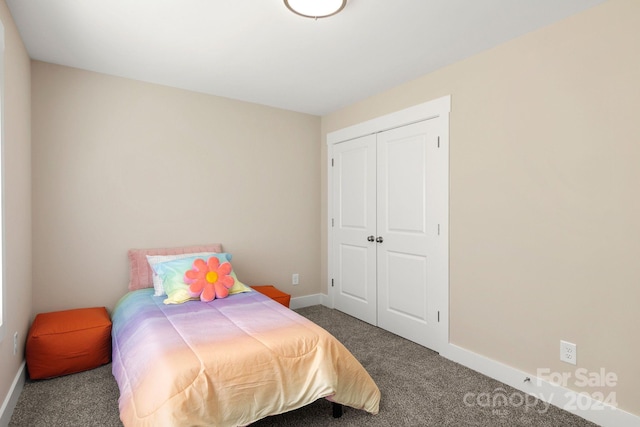 bedroom with carpet floors and a closet