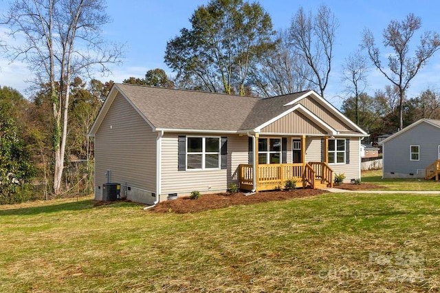 view of front facade with cooling unit and a front yard