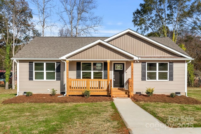 121 Orchard St, Forest City, NC 28043 - view of front of home featuring covered porch, crawl space, roof with shingles, and a front lawn