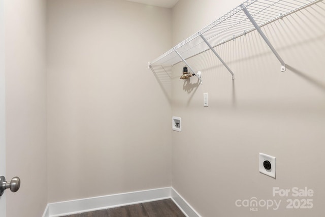 121 Orchard St, Forest City, NC 28043 - washroom with laundry area, washer hookup, baseboards, electric dryer hookup, and dark wood-type flooring