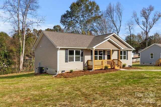 121 Orchard St, Forest City, NC 28043 - view of front facade with roof with shingles, cooling unit, a front yard, and crawl space