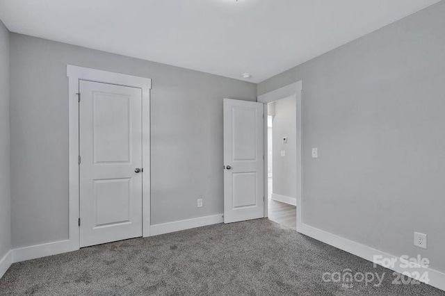 unfurnished bedroom featuring carpet