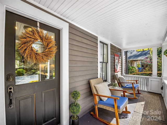 exterior space with wood ceiling and a wealth of natural light