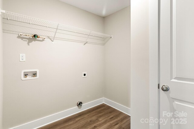 135 Orchard St, Forest City, NC 28043 - washroom featuring laundry area, baseboards, hookup for a washing machine, dark wood-style floors, and electric dryer hookup