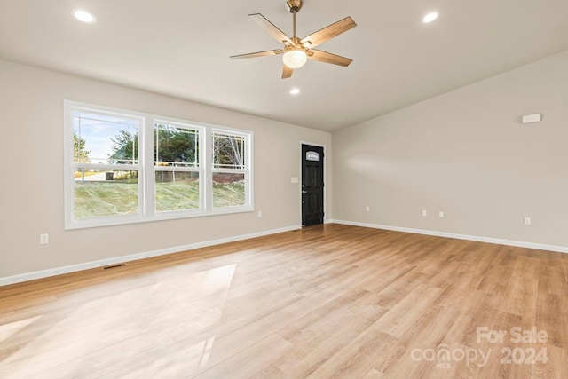 unfurnished living room with ceiling fan and light wood-type flooring