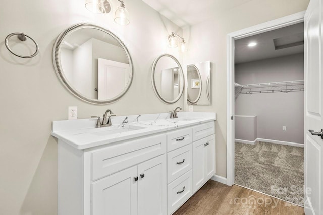 bathroom featuring vanity and hardwood / wood-style flooring