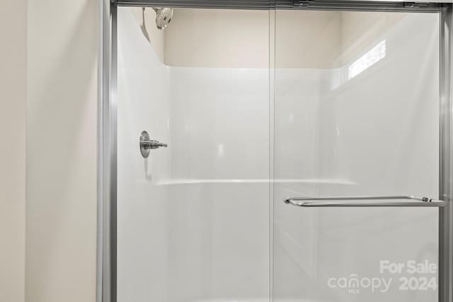 bathroom with an enclosed shower