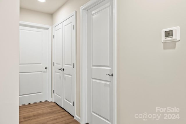 corridor featuring light hardwood / wood-style flooring