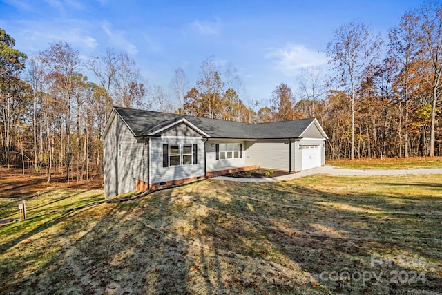 ranch-style home with a garage and a front yard