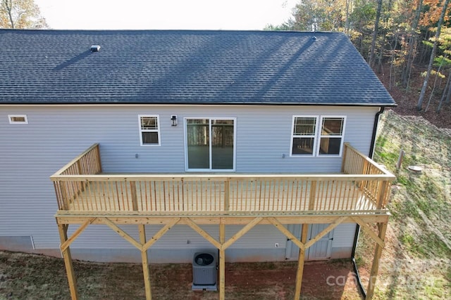 rear view of property featuring a deck