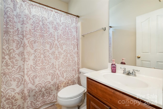 bathroom with vanity and toilet