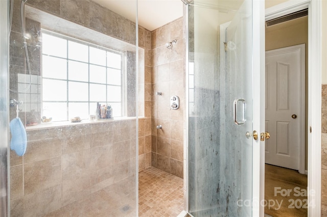 bathroom featuring walk in shower