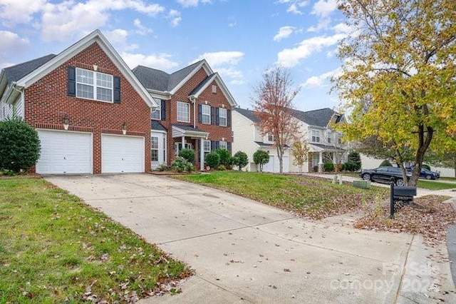 view of front property with a garage and a front lawn