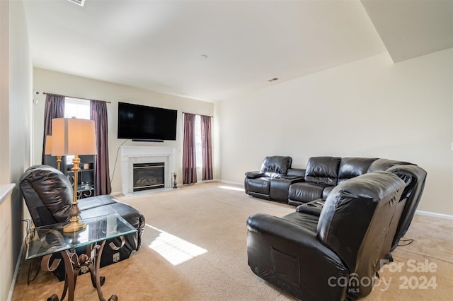 carpeted living room featuring a high end fireplace