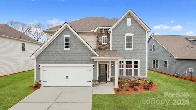 589 Fox Cove Rd, Hendersonville, NC 28792 - view of front facade featuring a garage and a front yard