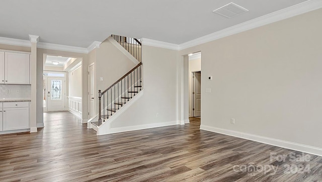 interior space featuring dark hardwood / wood-style flooring and crown molding