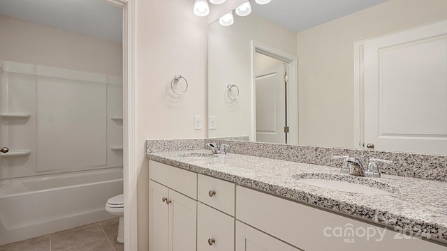 full bathroom with toilet, bathing tub / shower combination, vanity, and tile patterned floors