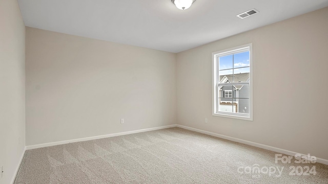 unfurnished room with carpet flooring