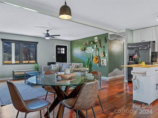 dining room with dark hardwood / wood-style floors and ceiling fan