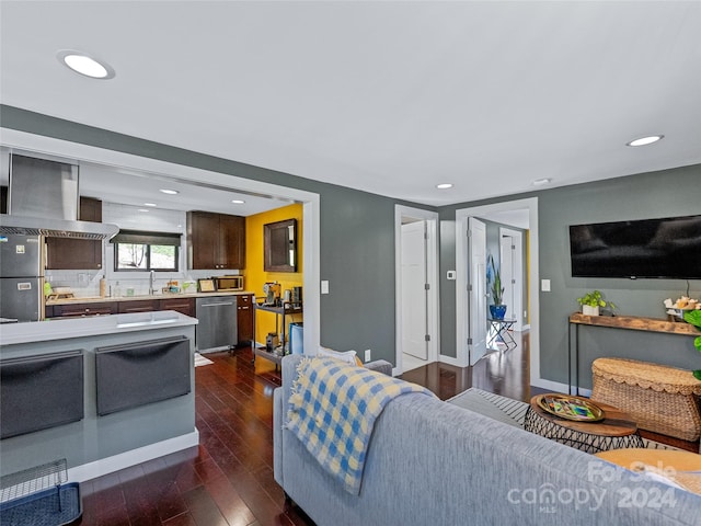 living room with dark wood-type flooring and sink