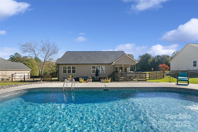 view of pool with a wooden deck