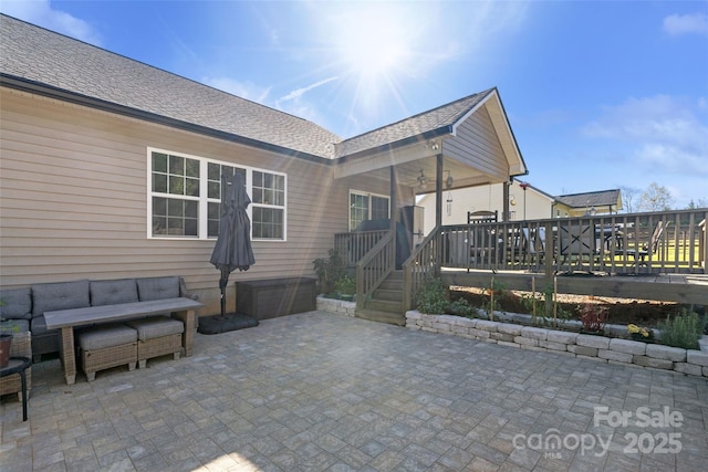 view of patio / terrace featuring a wooden deck and an outdoor hangout area