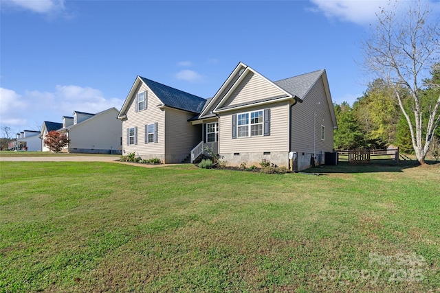 exterior space with central AC and a front lawn