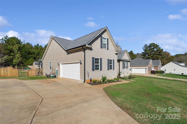 front of property with a front lawn and a garage