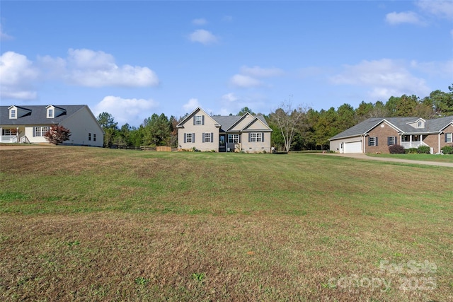 view of front of property with a garage and a front yard