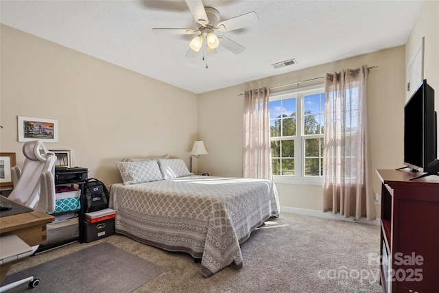 bedroom with ceiling fan and carpet floors